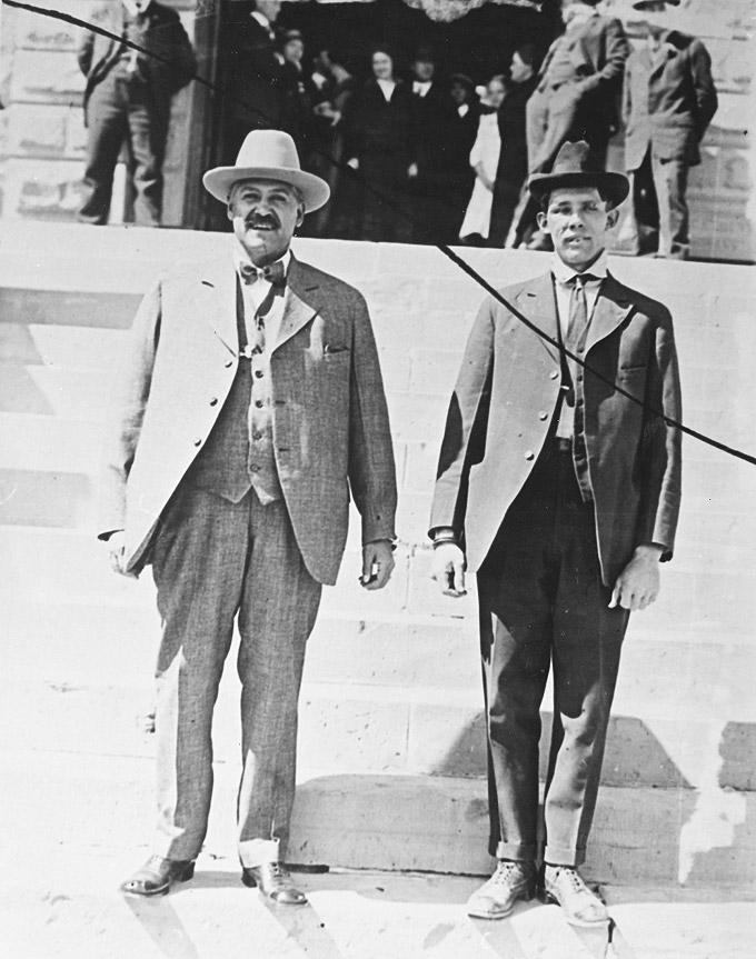 Bill Carlisle, right, and his captor Sheriff Rubie Rivera, on the steps of the Carbon County courthouse in Rawlins, 1916. (Courtesy Carbon County Museum.)
