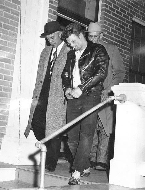 Charles Starkweather leaves the Converse County jail in the custody of two Nebraska lawmen. Though Wyoming Gov. Milward Simpson was a death-penalty opponent, he said he was willing to sign Starkweather's extradition papers. Casper College Western History Center.