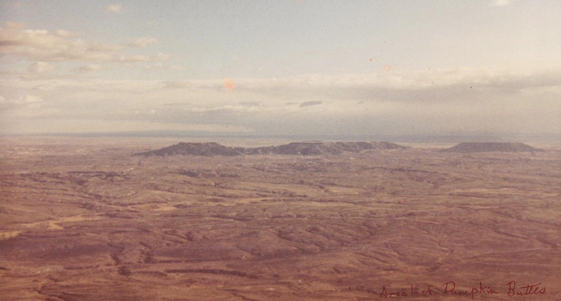 An undated aerial photo of Pumpkin Buttes and the country around Florence Blake’s land claim, looking west with the Bighorn Mountains beyond. It’s easy to see why she had a hard time getting much to grow Rockpile Museum. 