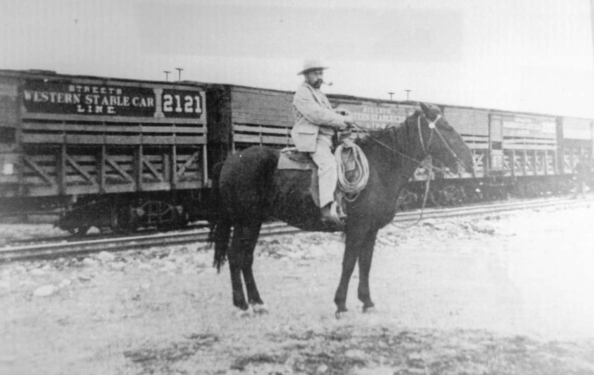 Franc at the railroad depot in Huntley, Mont., just east of Billings. He had an agreement with the Crow Tribe that allowed him to graze Pitchfork cattle on the reservation most of the summer as they moved from the Bighorn Basin slowly north to the railhead. Courtesy of the Meeteetse Museums.