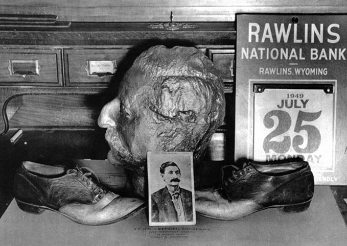 Death mask of Big Nose George Parrott and shoes made from his skin, on display at the Rawlins National Bank, 1949. Historical Reproductions by Perue. bignosegeorge2.jpg