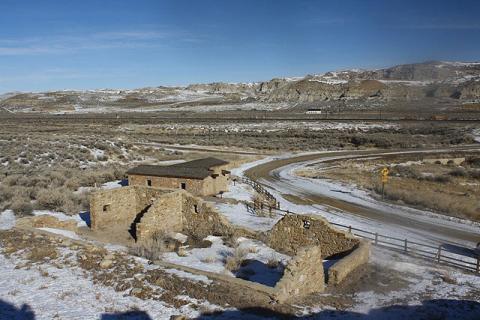 Point of Rocks Stage Station, with the ruined stables in the foreground  and Union Pacific Railroad and I-80 in the background. Tom Rea photo.