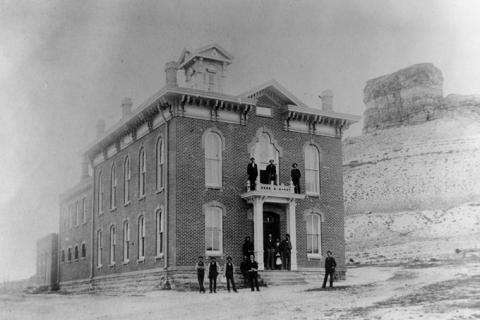 In 1875, the Territorial Legislature required Sweetwater County to move its county seat back to Green River, and build a courthouse (shown here) "of brick or stone of good material." Sweetwater County Historical Museum.