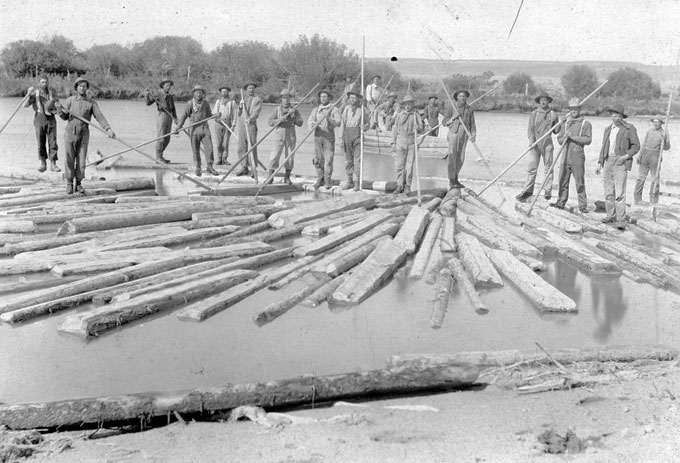 Tie-hacks, mostly from Sweden, Norway, Finland and Austria, were also called river rats and and were paid well for their dangerous work. They are shown here with pike poles, moving ties down the Green River in the 1890s. Bill and Carrie Budd photo, Thelma Budd collection.