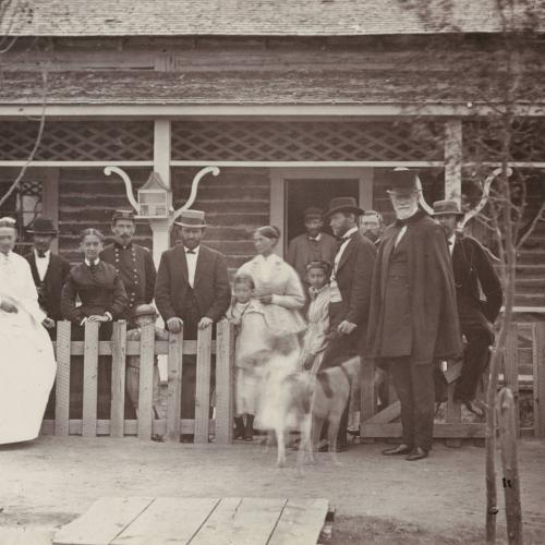 Ulysses S. Grant, in light colored hat with his hand on the fence, visits Fort Sanders south of Laramie, July, 1868. He was elected president the following November. Wikimedia.