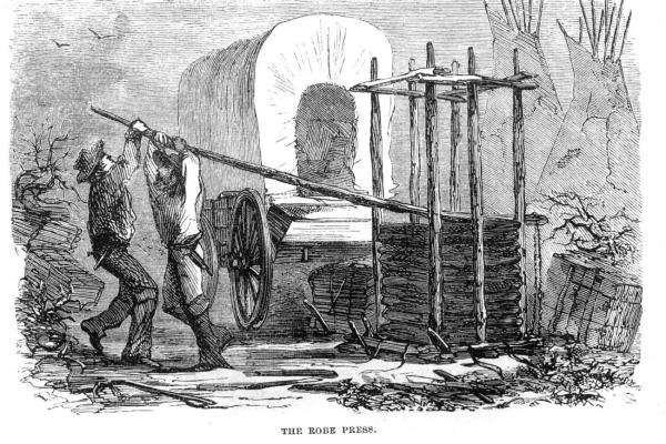 Etching of two men pulling down a long log lever above a pile of buffalo hides stacked in a frame, in front of a covered wagon 