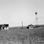 Keeper's residence, powerhouse and beacon tower of the intermediate field at Dana, Wyo., west of Medicine Bow, 1936. Kitching Collection, Hanna Basin Museum. 