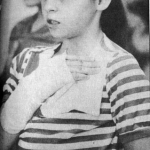 Jamie Buckley pledges allegiance to the flag the week after the Cokeville bombing. Bill Wilcox photo,  Casper Star-Tribune Collection, Casper College Western History Center.