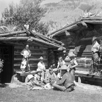 Larry Larom  entertains young customers on the Valley Ranch in the 1930s. Charles Belden photo, American Heritage Center.
