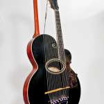 Harp guitar by Gibson Mandolin-Guitar Company, Kalamazoo, Michigan, 1914.  Hawaiian groups often included multi-stringed harp guitars. This one was played upright, like a regular guitar. National Music Museum, University of South Dakota, Bill Willroth, Sr., Photographer. 