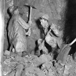 Guy Nichols and Hank Beecher in the tunnel at the Two Toms claim, 1911. Guy Nichols later became Lora's second husband. Lora Nichols collection, Encampment Museum.