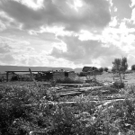 Outbuildings and, in the distance, main house on the Stewart homestead, 1984. Richard Collier, Wyoming SHPO.