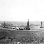Oil wells at the Teapot Dome field, looking south, 1920s. DOE.