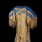 Pikuni Blackfeet (Piegan) woman’s dress ca. 1855-60, made of deer hide with small and large glass beads, wool cloth and sinew.  NMAI, Smithsonian Institution, catalog number 10/8454.