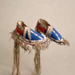 Exceptional Northern Plains moccasins made with hide, glass pony and smaller beads, wool cloth, metal cones and porcupine quills, about 1855-1860.  Such refined footwear would have been worn by Lakota dignitaries visiting Fort Laramie and the region. NMAI, Smithsonian Institution, catalog number 8/8057. 