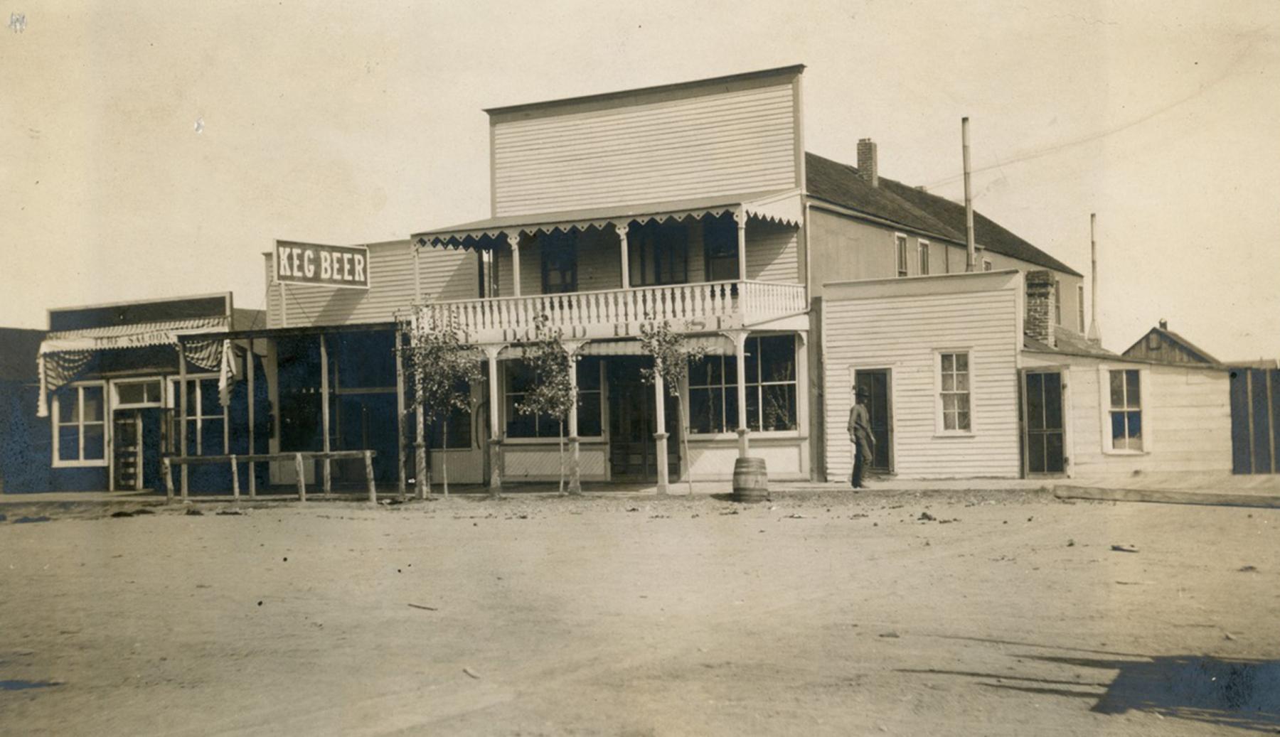 The Dodd House on Gillette Avenue in downtown Gillette, where Allie Means fled after being shot by Noah Richardson. Next to it is the Turf Saloon. Photo from about 1902-1905. Rockpile Museum.