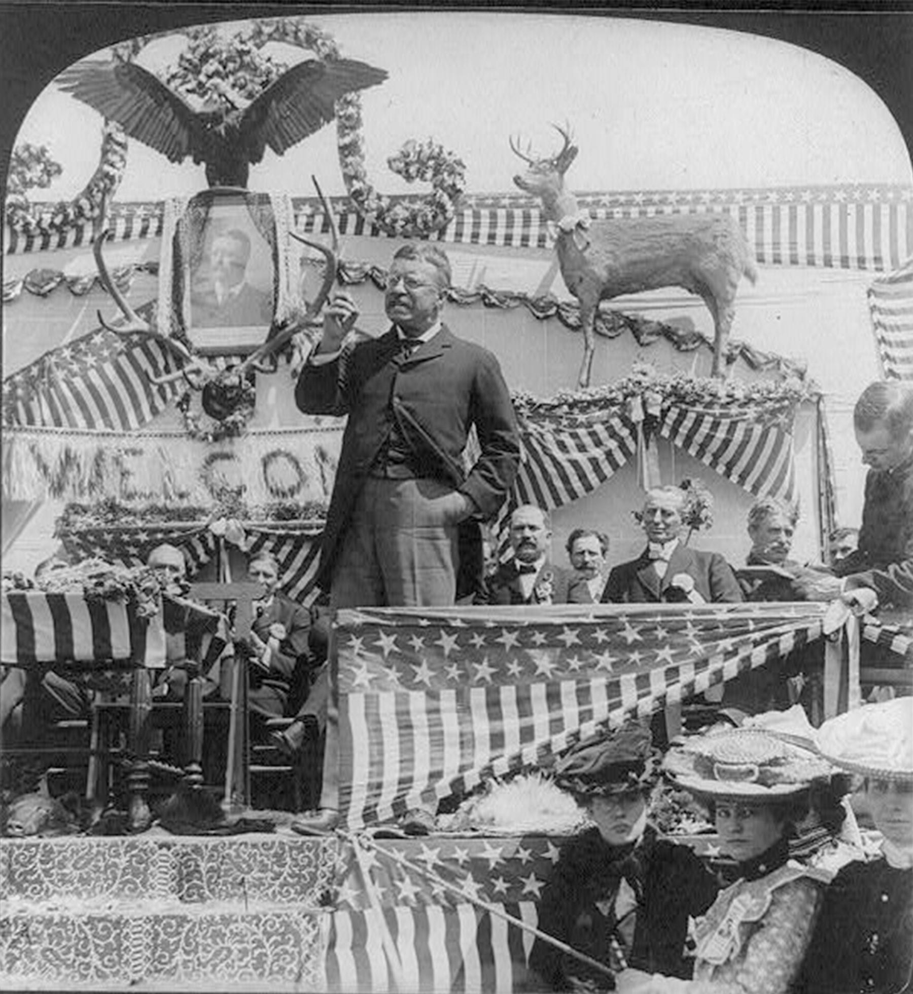 President Theodore Roosevelt, shown here giving a speech in Newcastle, swung through northeastern Wyoming in April 1903. When Congress gave him power to create national monuments, he used it promptly—on nearby Devils Tower. Library of Congress.