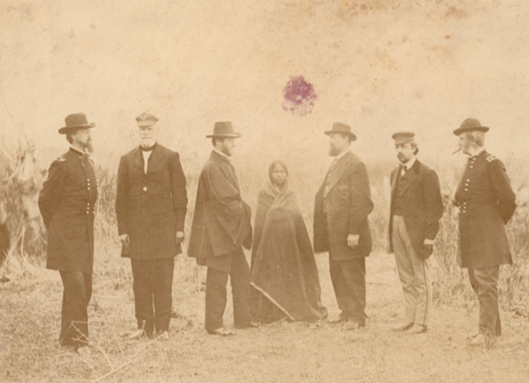 Commissioners at Fort Laramie for the 1868 treaty signing. From left to right Gen. Alfred Howe Terry, Gen. William S. Harney, General William Tecumseh Sherman, Sophie Mosseau, John B. Sanborn, Col. Samuel F. Tappan, and Gen. Christopher C. Augur. Sophie Mosseau was the daughter of a Lakota mother and French-speaking trapper. She later married Wyoming settler John “Posey” Ryan. Sherman collection of Gardner photographs; NMAI.