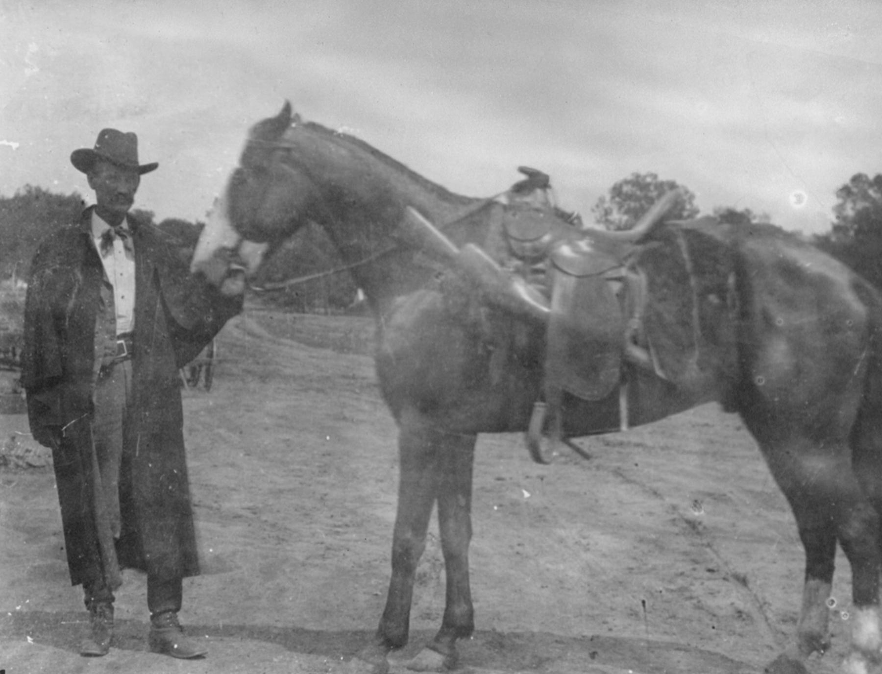 Frank Canton’s neighbor, Charlie Basch, testified that he saw a man on the road near he scene of the Tisdale murder in a coat and hat that looked like Frank Canton’s and riding a horse that looked like Canton’s horse, Fred. But he couldn’t be sure it was Frank Canton. Here, Frank Canton and a horse—perhaps Fred—in an undated photograph. American Heritage Center, University of Wyoming.