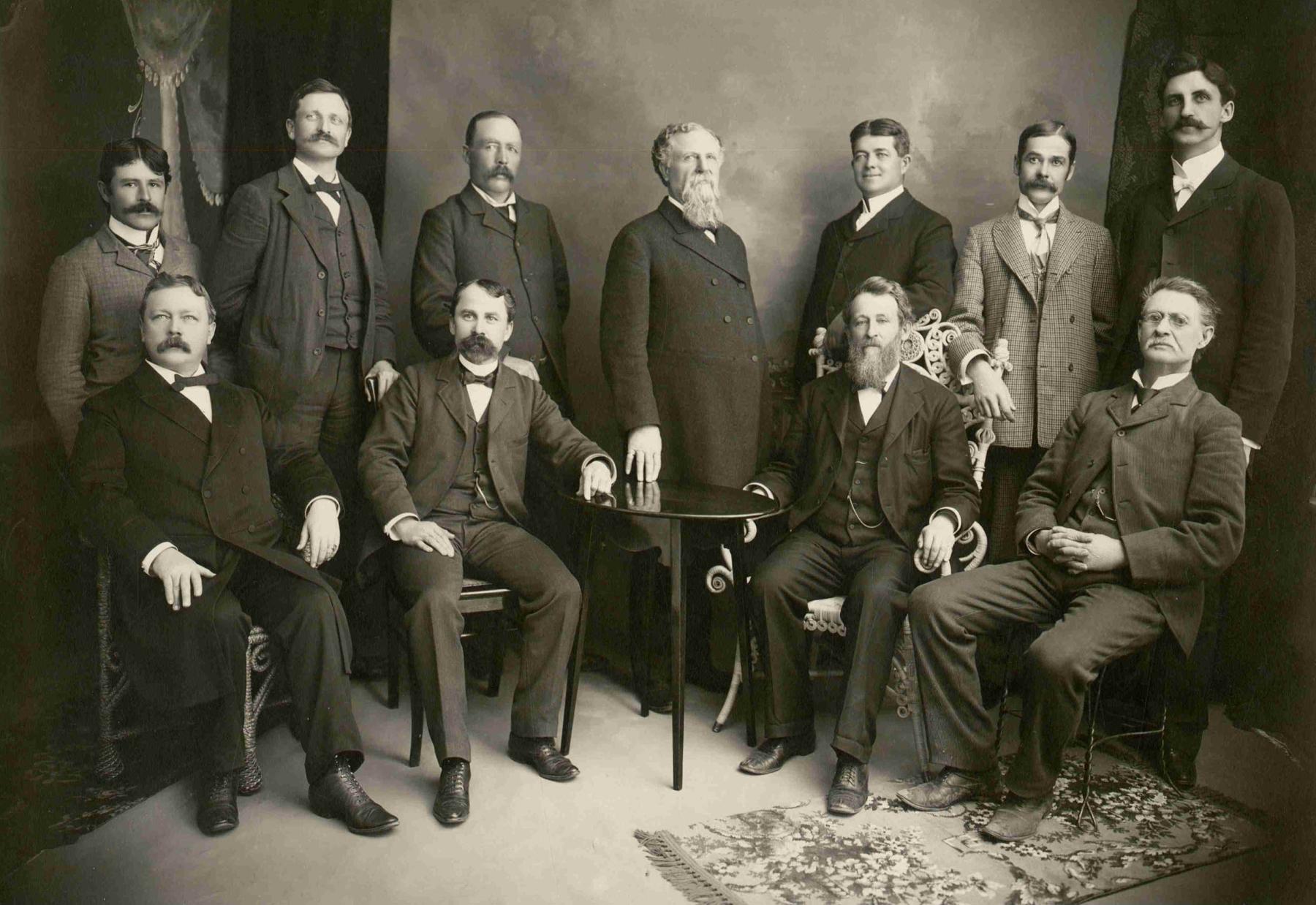 Members of the Albany County Bar in Laramie, 1901. Prominent lawyer and judge M.C. Brown is at center. Longtime Laramie attorney Stephen Downey is seated just to the right of the table. Downey’s son, Corlett Downey, stands in the back row at far left. Albany County Clerk of Court via Laramie Plains Museum.