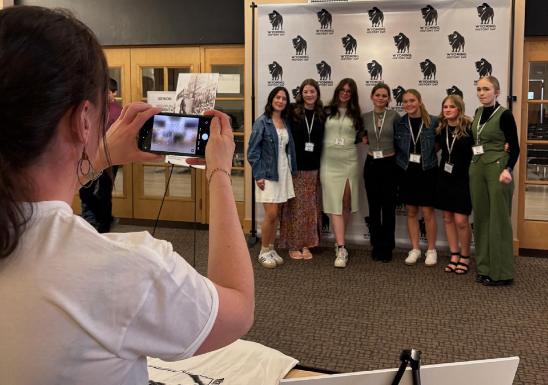 Winners of the 2025 Wyoming History Day Winners of the Wyoming History Day contest pose while a friend takes their photo