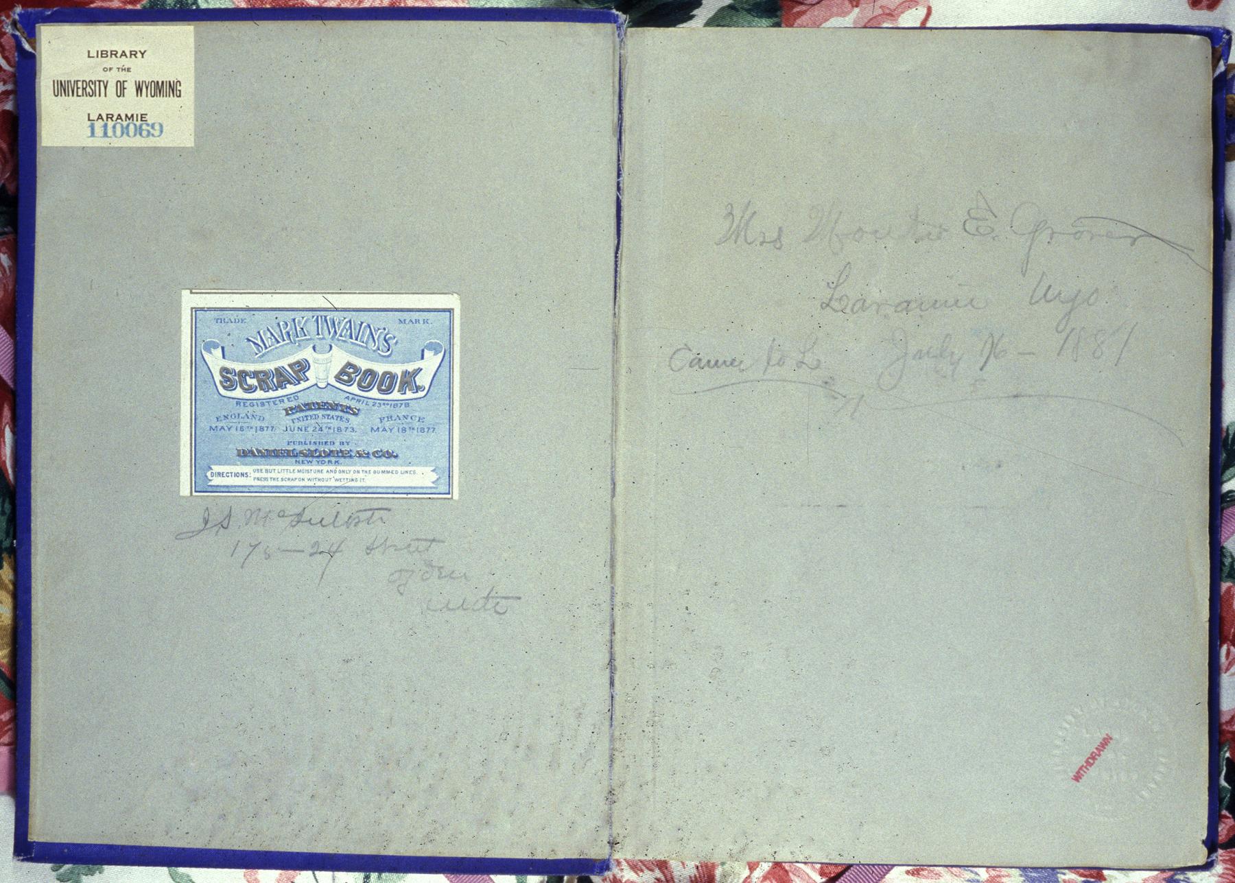 Inside cover pages of the scap with handwriting, "Mrs. [illegible] E Grover, Laramie, Wyo July 16 -1881"
