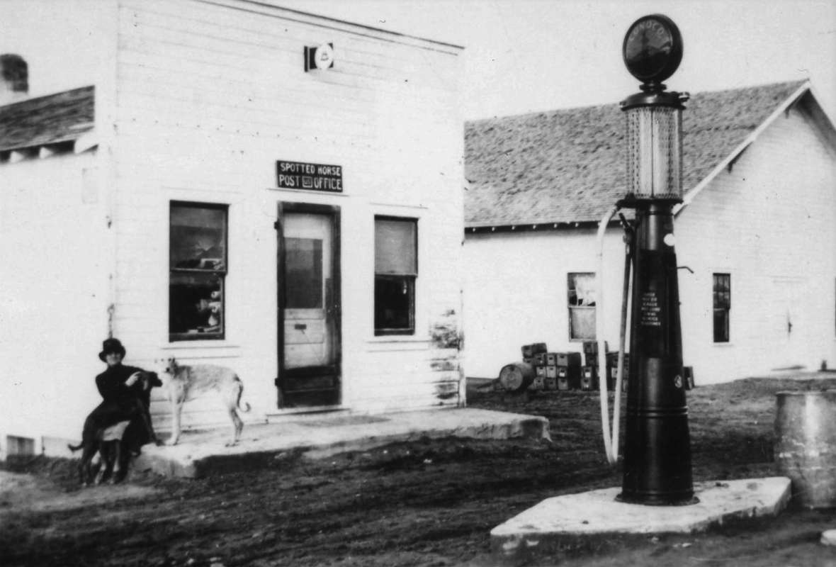 A survey conducted by the Wyoming State Highway Department rerouted the Black and Yellow trail to loop north between Gillette and Buffalo, passing through Spotted Horse (depicted here in the late 1920s). The general store and post office were burned and rebuilt, and the dance hall at right succumbed to a tornado in 1944, but today a traveler will still find a general store and the famous spotted horse. Campbell County Rockpile Museum.