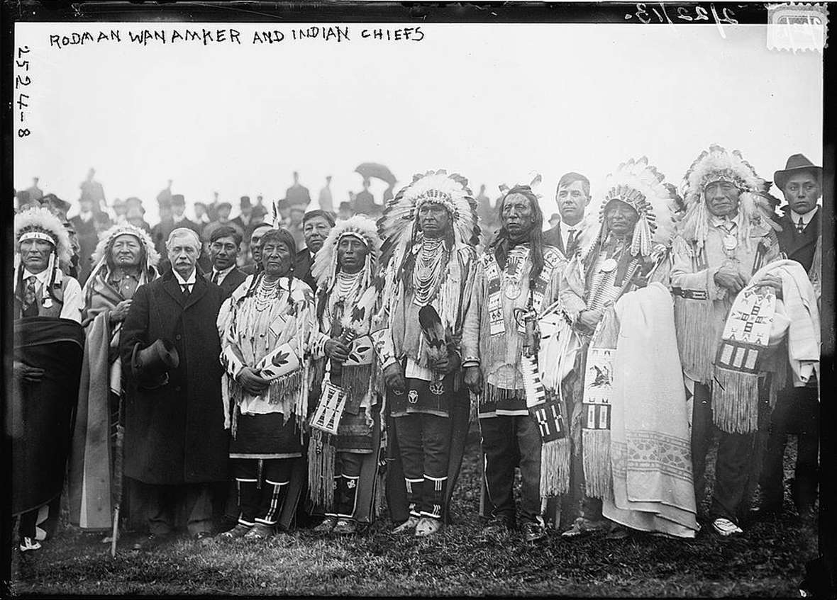 Around 30 American Indians from seven tribes joined Rodman Wanamaker, with top hat, at  the groundbreaking for a planned National American Indian Memorial on Staten Island in New York City in 1913. Wikipedia.