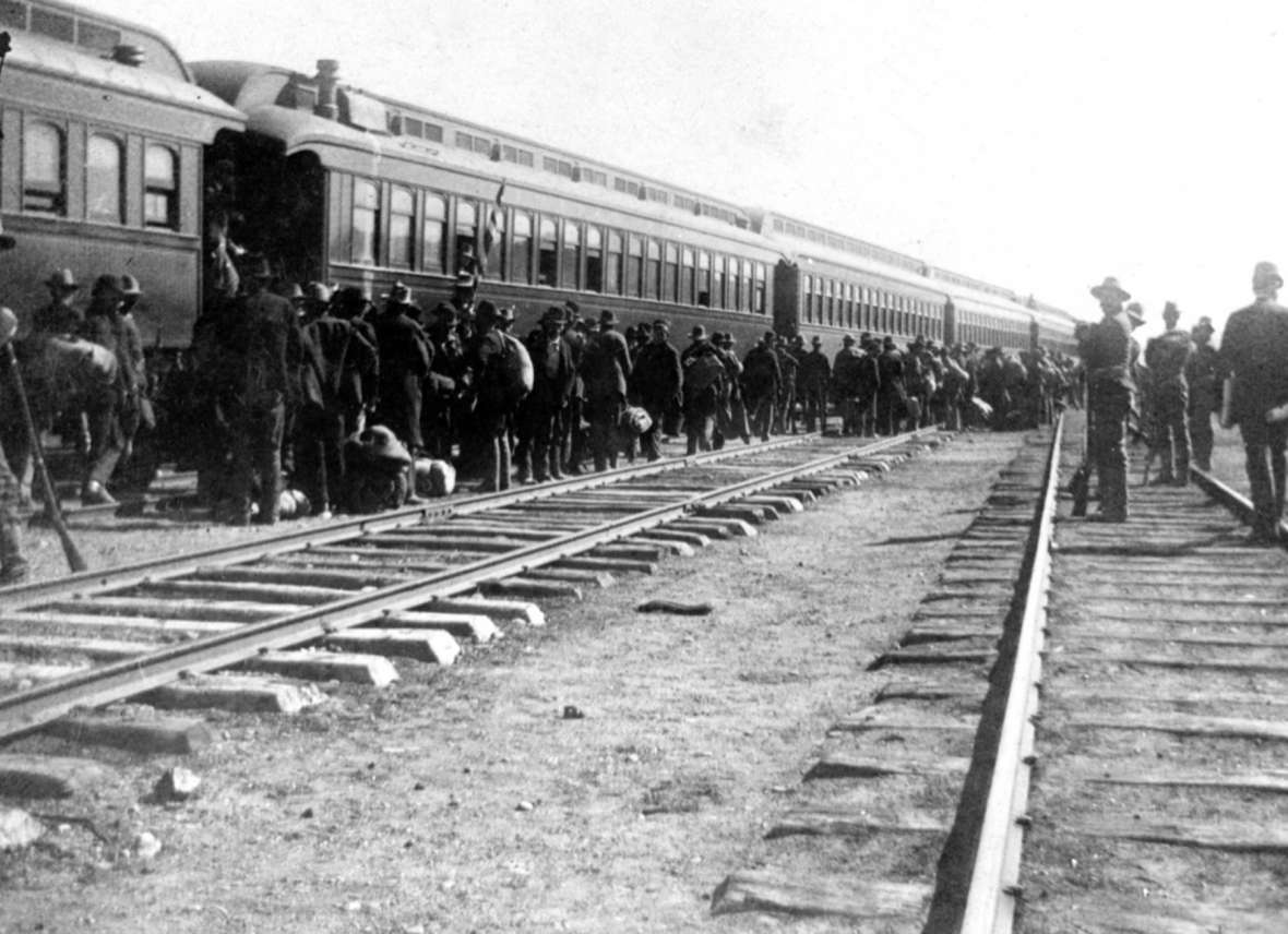 Coxeyites, with federal troops standing guard, board a train in Green River to head back to Idaho, where they were all found guilty and given minor sentences. Sweetwater County Historical Museum. Coxeyites, with federal troops standing guard, board a train in Green River to head back to Idaho, where they were all found guilty and given minor sentences. Sweetwater County Historical Museum.