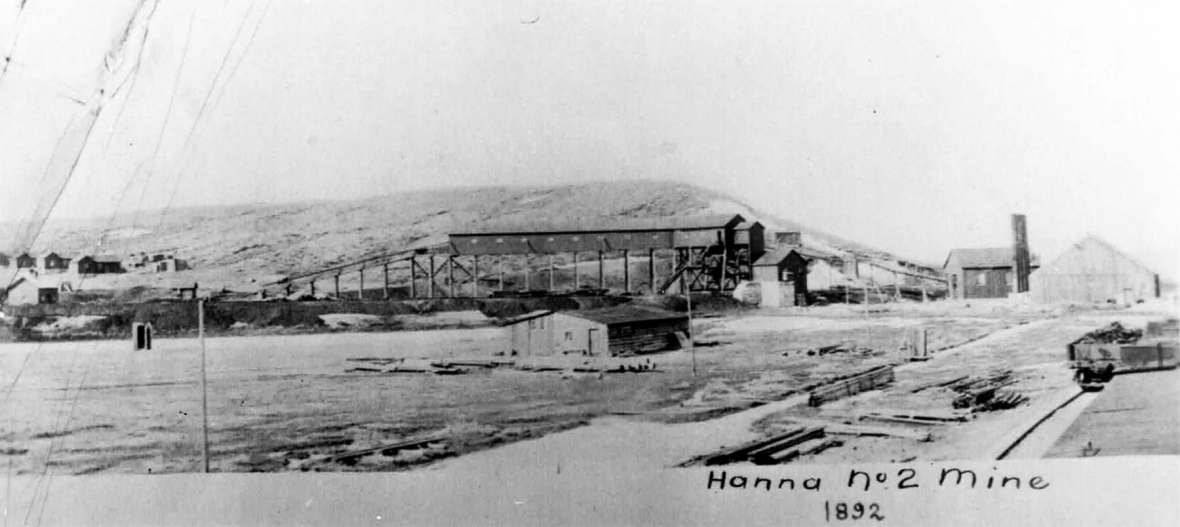 No photos of Dana have been identified. This 1892 image of the No. 2 mine in nearby Hanna, shows what area mining camps looked like. A coal tipple stands in the center of the photo with company housing visible in the distance at left. Sweetwater County Historical Museum.