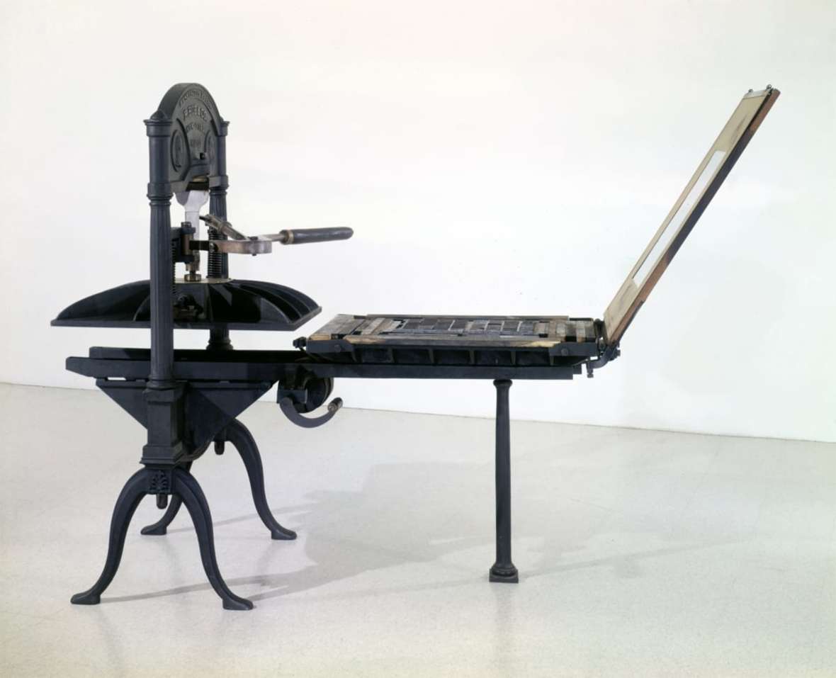 The Freeman brothers used a Washington hand press like this one to print their newspaper. The type lies flat on the bed, paper is lain over the type, the type bed rolls in under the platen and the operator applies pressure by pulling on the lever at chest height. The Henry Ford.