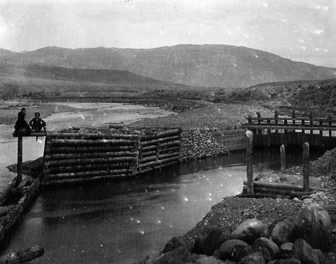 Headgate of a canal taking off from the South Fork of the Shoshone River upstream from Cody, Wyo., around 1896. The Shoshone Land and Irrigation Company, owned by George Beck and William F. Cody, began digging the canal the year before. American Heritage Center.