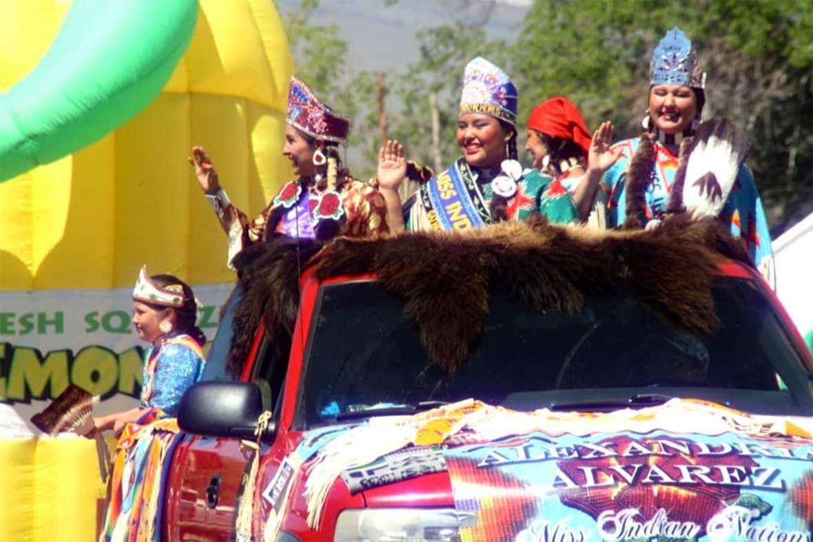 All American Indian Days and the Miss Indian America Pageant continue to inspire present generations. Left to right: Miss Native American U.S.A. Sarah Ortegon (Eastern Shoshone), Miss Indian World Taylor Thomas (Shoshone-Bannock) and Miss Indian Nations Alexandra Alvarez in a float at Eastern Shoshone Days on the Wind River Reservation in Wyoming, 2014. Gregory Nickerson/WyoFile. 