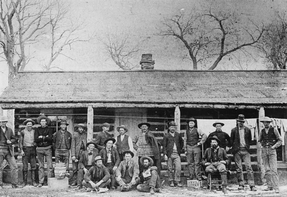 Pitchfork cowboys in front of the bunkhouse, late 1880s. Courtesy of the Meeteetse Museums. Pitchfork cowboys in front of the bunkhouse, late 1880s. Courtesy of the Meeteetse Museums.