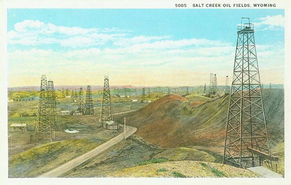 A postcard of derricks in the Salt Creek Field in the 1920s, when it was among the largest-producing fields in the world. Wyoming Tales and Trails.