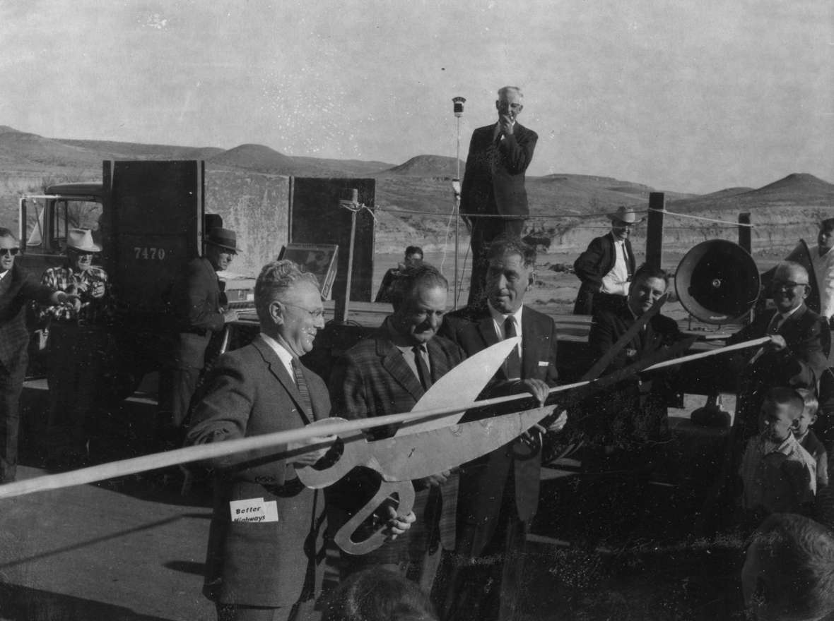 Five and a half years after controversy over the proposed route of Interstate 90 in Wyoming was settled, officials celebrated the opening of the new highway bridge over Powder River, halfway between Gillette and Buffalo, Wyo. The dispute almost certainly cost Gov. Milward Simpson a large number of votes in Sheridan County. Campbell County Rockpile Museum.