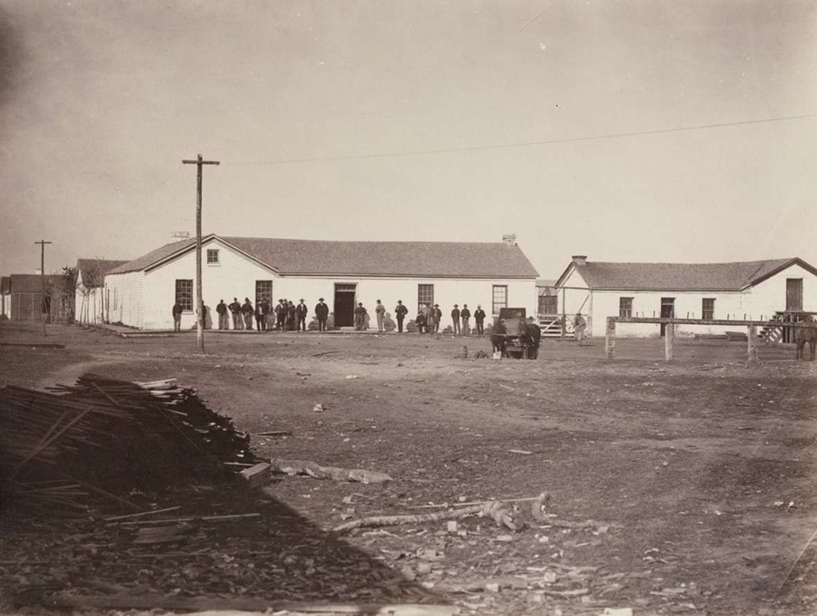 Buildings, people and telegraph poles, Fort Bridger, late 1860s. A.J. Russell. Beinecke Library, Yale.