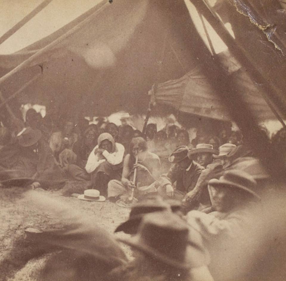 “Interior of Council Chamber. Man Afraid of His Horses, smoking.” Detail from a stereo photograph by Alexander Gardner, Fort Laramie 1868. Identified by professor Raymond J. DeMallie as the first known image of a Native person—Man Afraid of His Horses was an Oglala leader—smoking the pipe at a treaty gathering. Augur Collection, the Newberry Library.