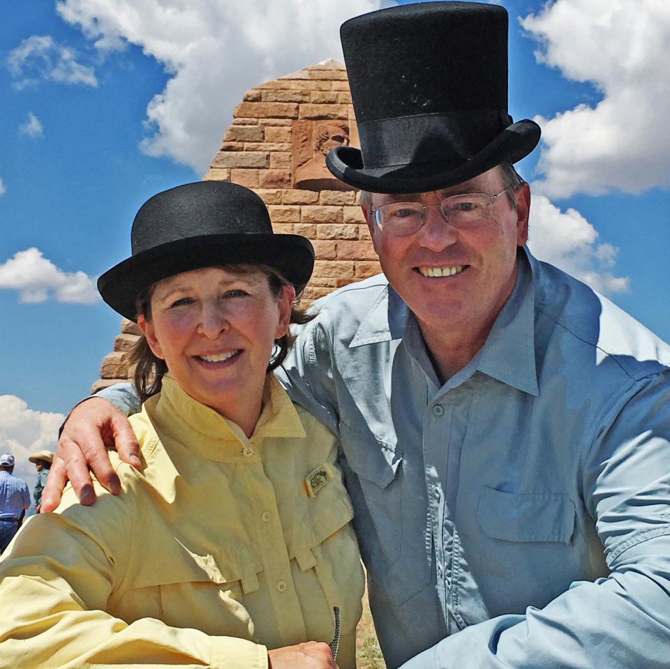 Leslie and Robert ham it up—in partial period costume—during the dedication of Ames Monument as a National Historic Landmark in July 2017. The huge rock pyramid was constructed in the early 1880s next to Union Pacific Railroad tracks between Cheyenne and Laramie. It’s named after railroad financiers and brothers Oakes Ames and Oliver Ames Jr. A woman in a derby and a man in a top hat pose smiling in front of a sandstone monument on a sunny day.