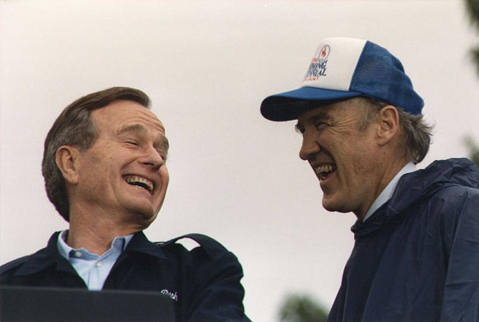 President George H. W. Bush and Sen. Alan Simpson smile and laugh together