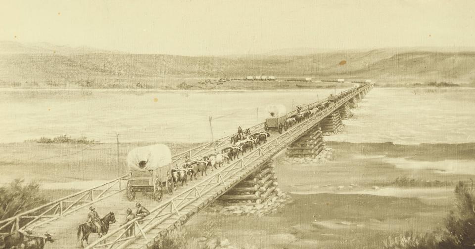 Drawing of a wagon train and many people on foot and horseback crossing a long wooden bridge over a wide river