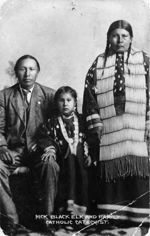 Black Elk took the first name Nicholas during his years as a catechist for the Catholic Church. Here he is with his daughter, Lucy, and wife, Anna Brings White, at their home in Manderson, So. Dak., on the Pine Ridge Reservation about 1910. Wikipedia. Black Elk took the first name Nicholas during his years as a catechist for the Catholic Church. Here he is with his daughter, Lucy, and wife, Anna Brings White, at their home in Manderson, So. Dak., on the Pine Ridge Reservation about 1910. Wikipedia.