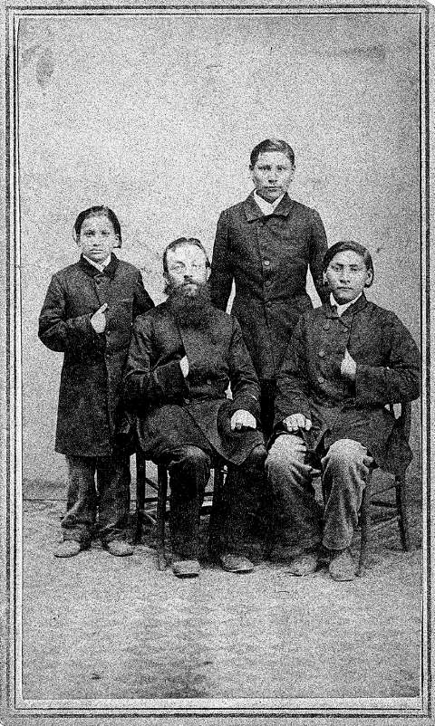 Cheyenne boys Brown Moccasin, Little Bone and Owl Head arrived with their Lutheran custodians at Wartburg Seminary near Dubuque, Iowa, late in 1864, after the Lutherans failed in a multi-year attempt to establish missions in what’s now Wyoming. Shown here are the three boys that year—it’s unrecorded which is which—with missionary Karl Krebs. Samuel Root photo, Wartburg Theological Seminary Archives. Cheyenne boys Brown Moccasin, Little Bone and Owl Head arrived with their Lutheran custodians at Wartburg Seminary near Dubuque, Iowa, late in 1864, after the Lutherans failed in a multi-year attempt to establish missions in what’s now Wyoming. Shown here are the three boys that year—it’s unrecorded which is which—with missionary Karl Krebs. Samuel Root photo, Wartburg Theological Seminary Archives.