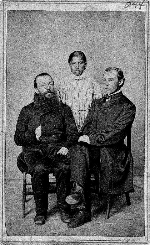 Missionary Karl Krebs, left, Brown Moccasin and missionary Christian Flachenecker in Iowa, 1864. The Cheyenne boys Brown Moccasin and Little Bone both died of tuberculosis that year. Owl Head, the third Cheyenne brought east by the Lutherans, eventually abandoned his teachers and wandered the region, working to support himself and going by the name of Fred Green. He died in 1876. Samuel Root photo, Wartburg Theological Seminary Archives.