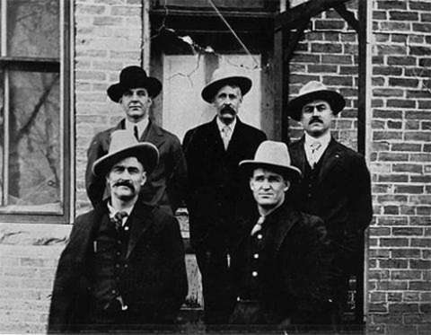 Defendants in the Spring Creek Raid case outside the Big Horn County Courthouse in Basin, Wyo.. Clockwise from top left: Herb Brink, Ed Eaton, George Saban, Tom Dixon, Milton Alexander. Washakie Museum photo. Defendants in the Spring Creek Raid case outside the Big Horn County Courthouse in Basin, Wyo.. Clockwise from top left: Herb Brink, Ed Eaton, George Saban, Tom Dixon, Milton Alexander. Washakie Museum photo.