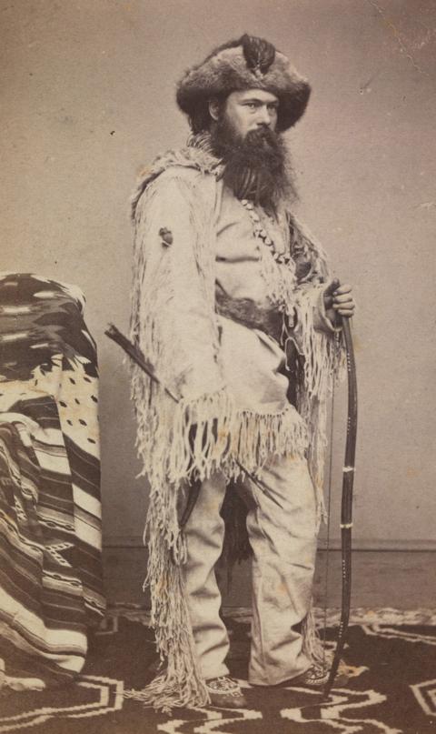 Alexander Gardner, self-portrait, ca. 1861, taken at the Mathew Brady Gallery in Washington, D. C. This fanciful image shows the photographer dressed as a frontiersman—but he was not yet experienced with the West. He met real mountaineers at Fort Laramie in 1868, but, like most people there, he wore wool and cotton clothes. National Portrait Gallery, Smithsonian Institution. 