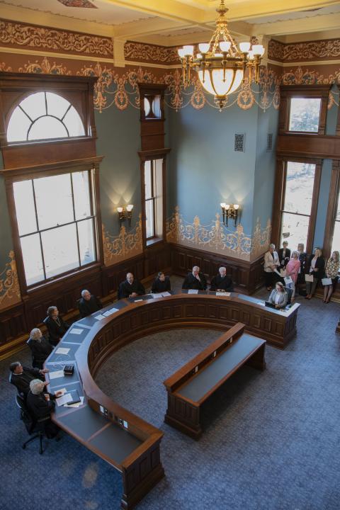 The Historic Supreme Court room after the restoration, during its opening ceremony. State of Wyoming View looking down at the Wyoming Supreme Court justices seated in the restored room