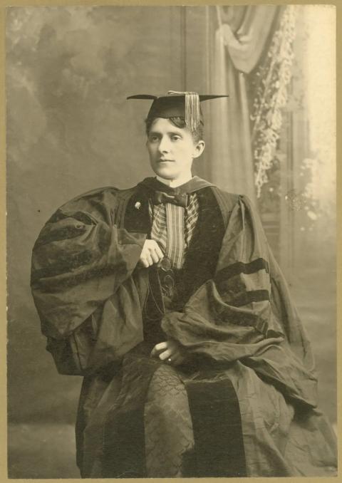 Grace’s graduating photo in 1882 from the University of Iowa. Studio portrait of woman wearing cap and gown