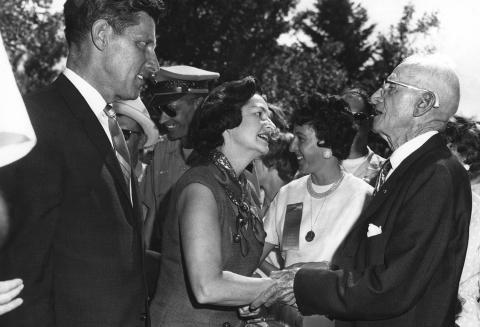 William Hutton, Jr. (the great-grandfather of the author) greets Lady Bird Johnson and U.S. Senator Gale McGee (D-WY) on the lawn of the Sweetwater County Courthouse in Green River on August 17, 1964. This was during the dedication ceremony of Flaming Gorge Dam and Reservoir. Lady Bird Johnson shakes hands with Sen. Dale McGee as William Hutton Jr. looks on.