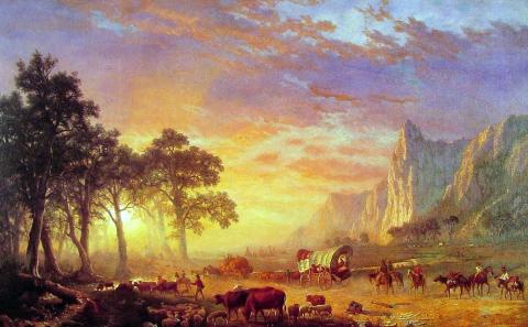 romantic oil painting of glowing sunset behind covered wagon and cattle next to sheer cliffs